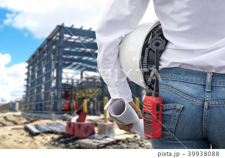 Engineer woman holding white helmet 39938088