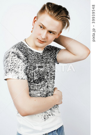 young handsome teenage hipster guy posing emotional, happy smili young handsome teenage hipster guy posing emotional, happy smili 39939548