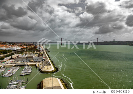 Wide view 25 de Abril Bridge in Lisbon over Tagus river 39940339