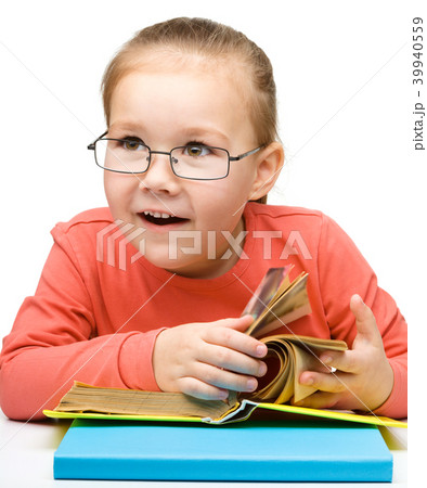 Little girl is reading a book Little girl is reading a book 39940559