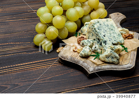 Slice of French Roquefort cheese on wooden board 39940877
