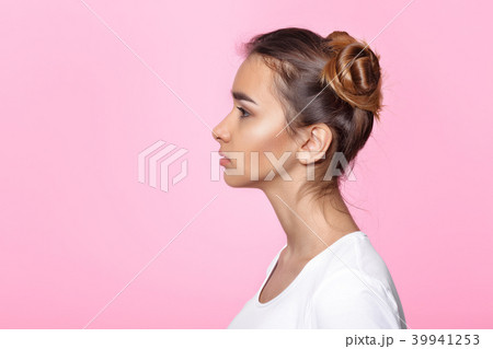young woman on pink background Attractive beautiful woman showing air kiss 39941253