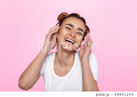 young woman on pink background Attractive beautiful woman showing air kiss 39941254