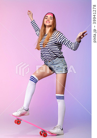 beautiful woman with skate in studio 39941278
