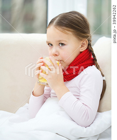 Ill little girl is drinking vitamin cocktail Ill little girl is drinking vitamin cocktail 39942262