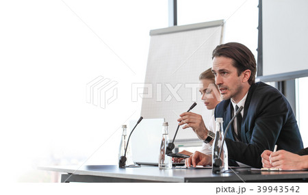 Speakers at business meeting Speakers at business meeting 39943542