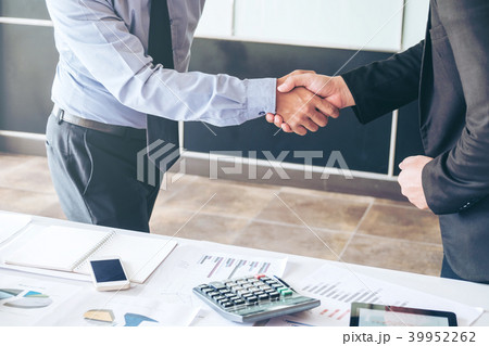 Business people colleagues shaking hands meeting Business people colleagues shaking hands meeting 39952262
