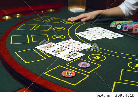 Casino black jack table with chips and cards. Casino black jack table with chips and cards. 39954619