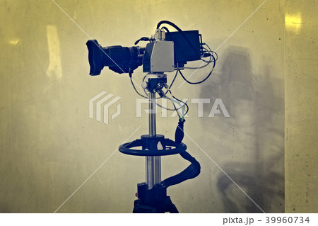 Video camera on a tripod 39960734
