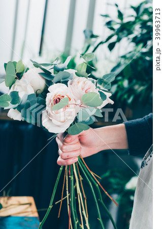 Pink rose in brides flower bouquet 39963713