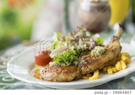 Grilled pork chop steak with vegetable salad 39964807