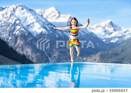 Child in outdoor swimming pool of alpine resort 39966847