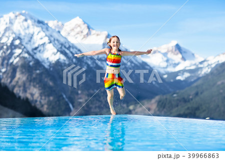 Child in outdoor swimming pool of alpine resort 39966863