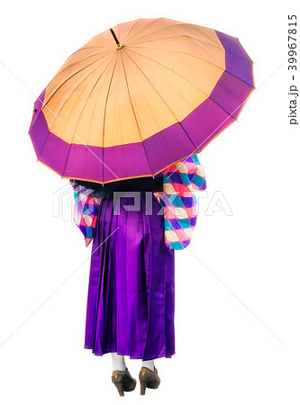 A girl in a purple dress standing under lilac umbrella. Back view of woman in kimono holding big A girl in a purple dress standing under lilac umbrella. Back view of woman in kimono holding big 39967815