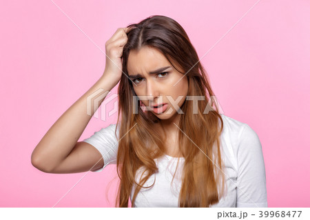 young woman on pink background Attractive beautiful woman showing air kiss 39968477