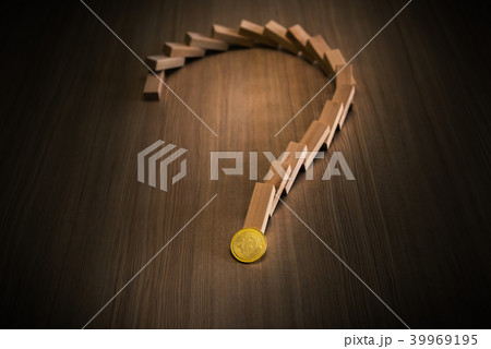 Dominoes falling and question marks with bitcoin 39969195