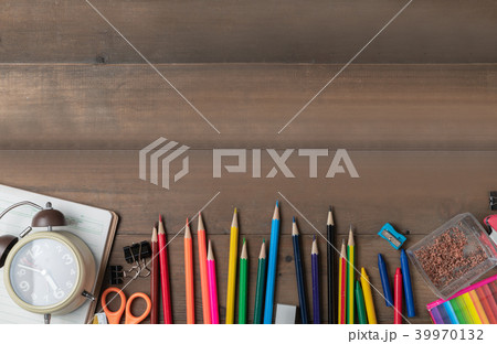 coloured pencil with alarm clock and stationary coloured pencil with alarm clock and stationary 39970132