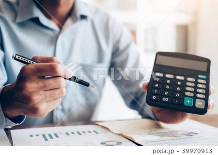 Male accountant or banker use calculator. Male accountant or banker use calculator. 39970913