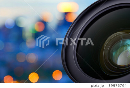 Closeup of camera lens on blur bokeh background 39976764