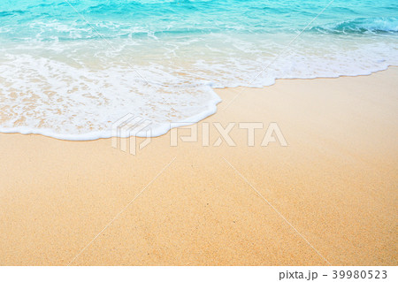 Wave and foam of the sea on the sand beach. Wave and foam of the sea on the sand beach. 39980523