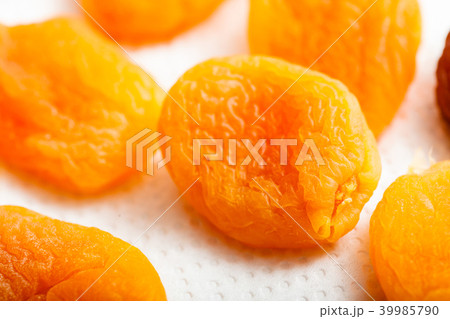 Detailed closeup of orange dried apricots Detailed closeup of orange dried apricots 39985790