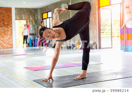 Yoga pose in gym. 39986214