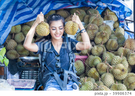 Asian woman hand holding durian Asian woman hand holding durian 39986374