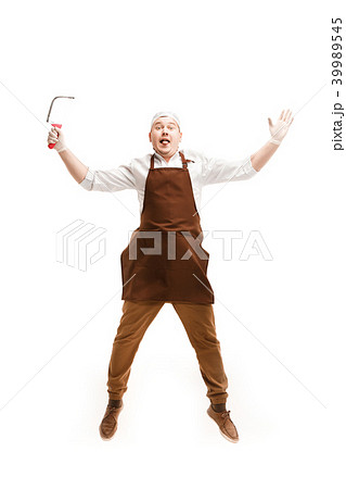 Smiling butcher posing with a cleaver isolated on white background Smiling butcher posing with a cleaver isolated on white background 39989545
