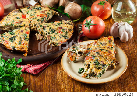Portion of frittata made of eggs and mushrooms Portion of frittata made of eggs and mushrooms 39990024