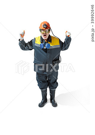 The studio shot of senior bearded male miner standing at the camera on a white background. The studio shot of senior bearded male miner standing at the camera on a white background. 39992646