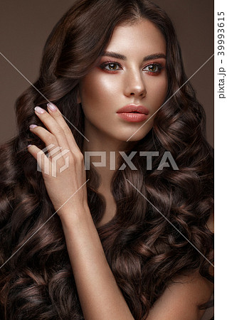 Beautiful brunette model: curls, classic makeup and full lips. The beauty face. Beautiful brunette model: curls, classic makeup and full lips. The beauty face. 39993615
