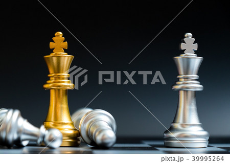 Gold and silver king chess piece in chessboard Gold and silver king chess piece in chessboard 39995264