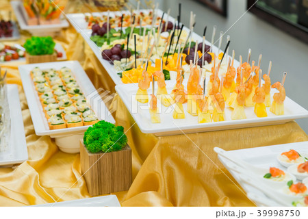 Catering table with dishes and snacks on event Catering table with dishes and snacks on event 39998750