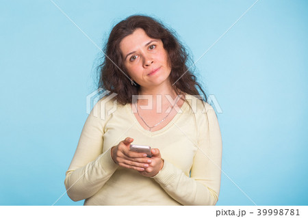 Sad and resentful woman waiting for excuses and explanations and is reproachfully looking isolated Sad and resentful woman waiting for excuses and explanations and is reproachfully looking isolated 39998781
