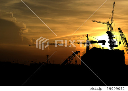 Silhouette crane construction building at sunset 39999032