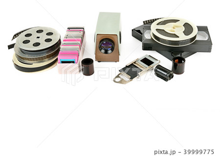 Old videocassettes and video projector with slides 39999775