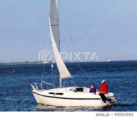 Enjoying an afternoon sailboat ride 40002681