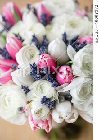 Wedding bouquet of pink tulip and white buttercup. Modern bridal bunch. Dry lavender Wedding bouquet of pink tulip and white buttercup. Modern bridal bunch. Dry lavender 40008072