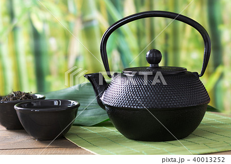 Green tea with black china kettle. Chinese tea. Green tea with black china kettle. Chinese tea. 40013252