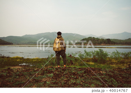 People stood overlooking the mountains and rivers People stood overlooking the mountains and rivers 40014767