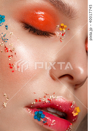Beautiful girl with art make-up and flowers. beauty face. 40017745