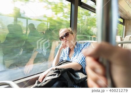 Portrait of tired woman sleeping on bus. Portrait of tired woman sleeping on bus. 40021279