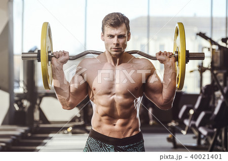 handsome strong bodybuilder men pumping up muscles 40021401