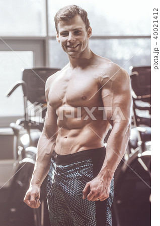 handsome strong bodybuilder men pumping up muscles 40021412