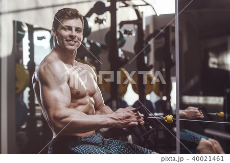handsome strong bodybuilder men pumping up muscles 40021461