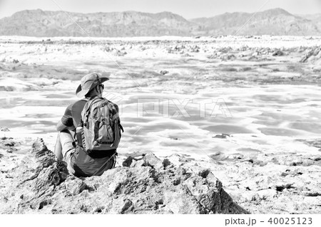 near the depression volcano land a backpacker near the depression volcano land a backpacker 40025123