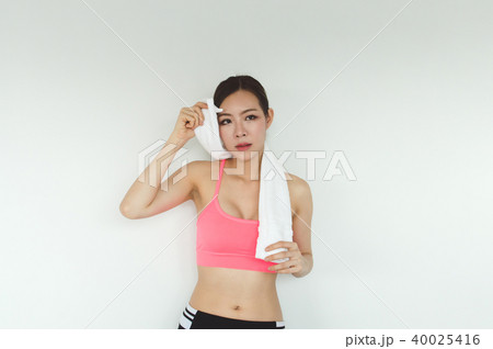 Sports concept. Beautiful girl is exercising in the home with wa 40025416