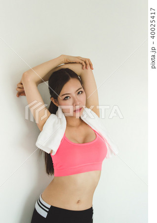 Sports concept. Beautiful girl is exercising in the home with wa 40025417