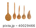 Old wooden spoons and stirrers on white background 40029466