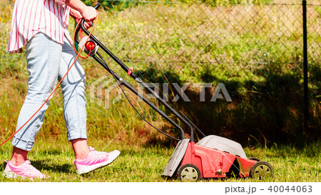 Gardening. Mowing lawn with lawnmower Gardening. Mowing lawn with lawnmower 40044063